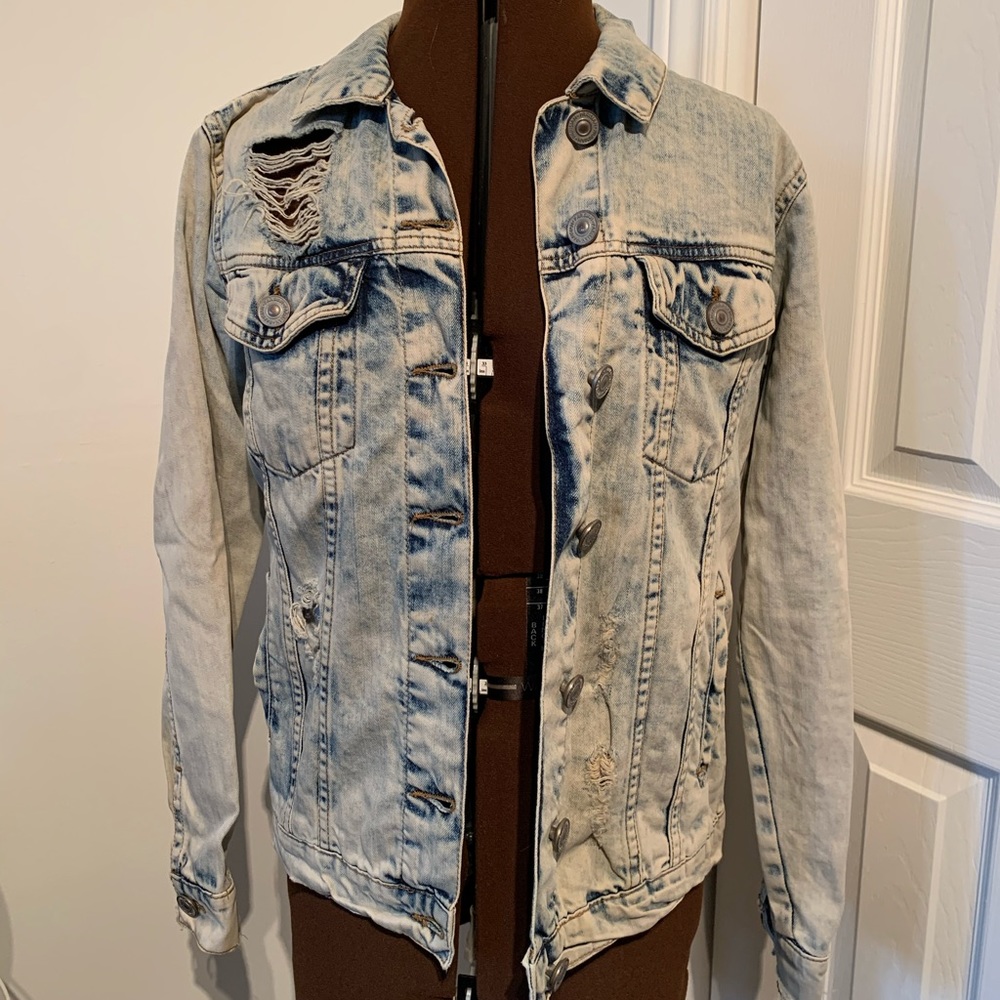 Ripped acid wash jean jacket.